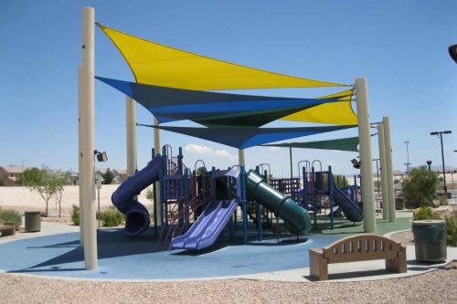 Shading structure over a playground, made by company USA Shade